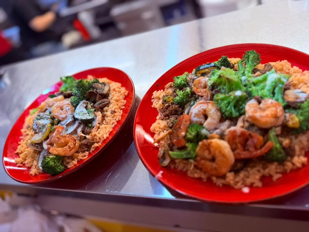Super ACP plates with shrimp, steak, vegetables, and rice